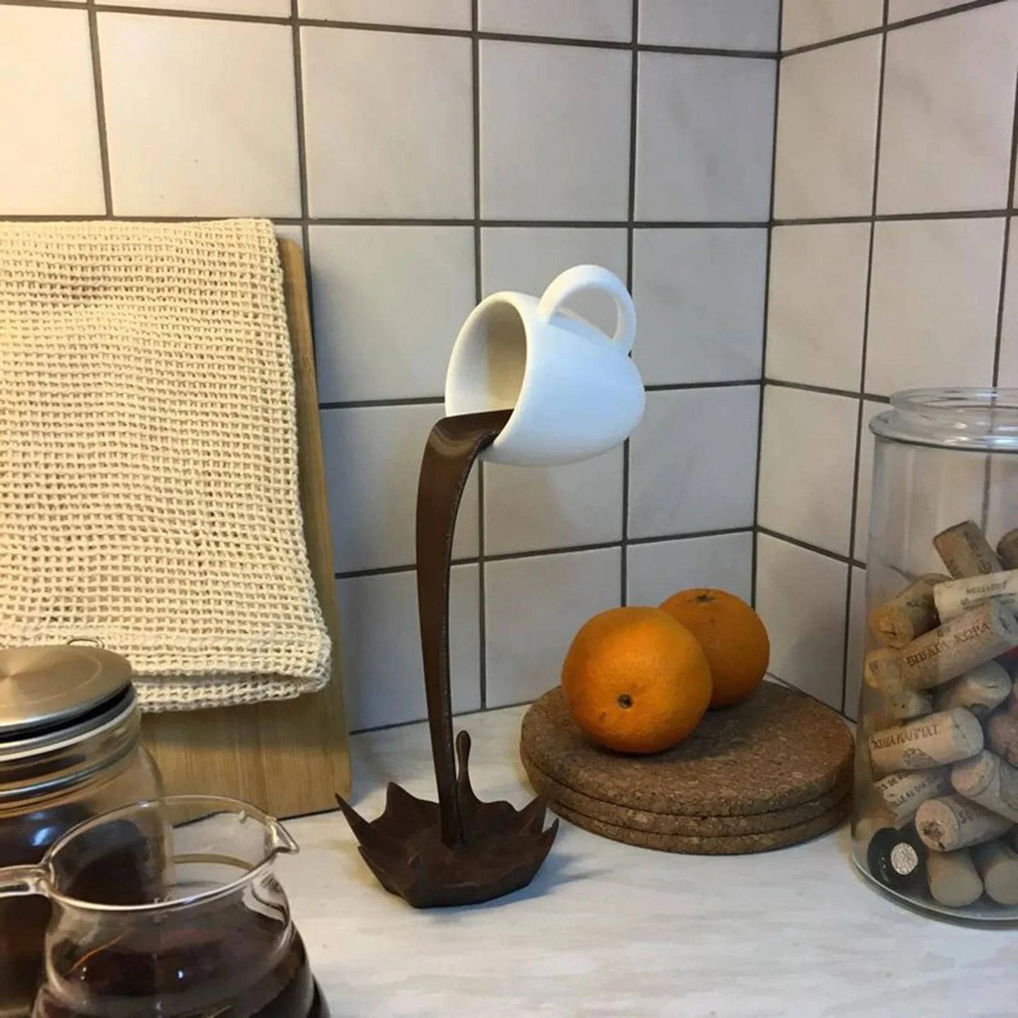 Contemporary Floating Coffee Cup Sculpture: Unique Kitchen Decor with Pouring Splash - Creative Desktop Accent - Home Fads